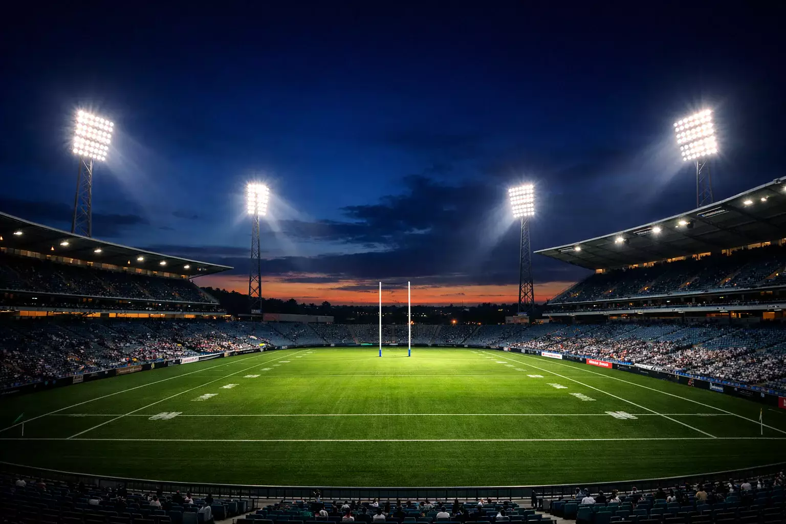 Rugby league stadium with floodlights during evening match